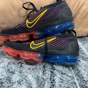 Nike Flyknit Sneakers with Black and Yellow Accents